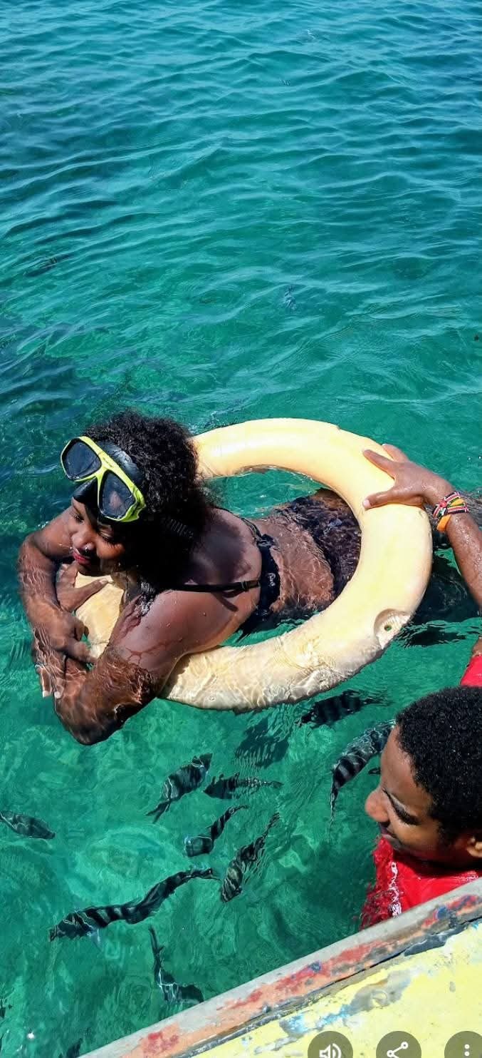 Guest snorkeling with fish